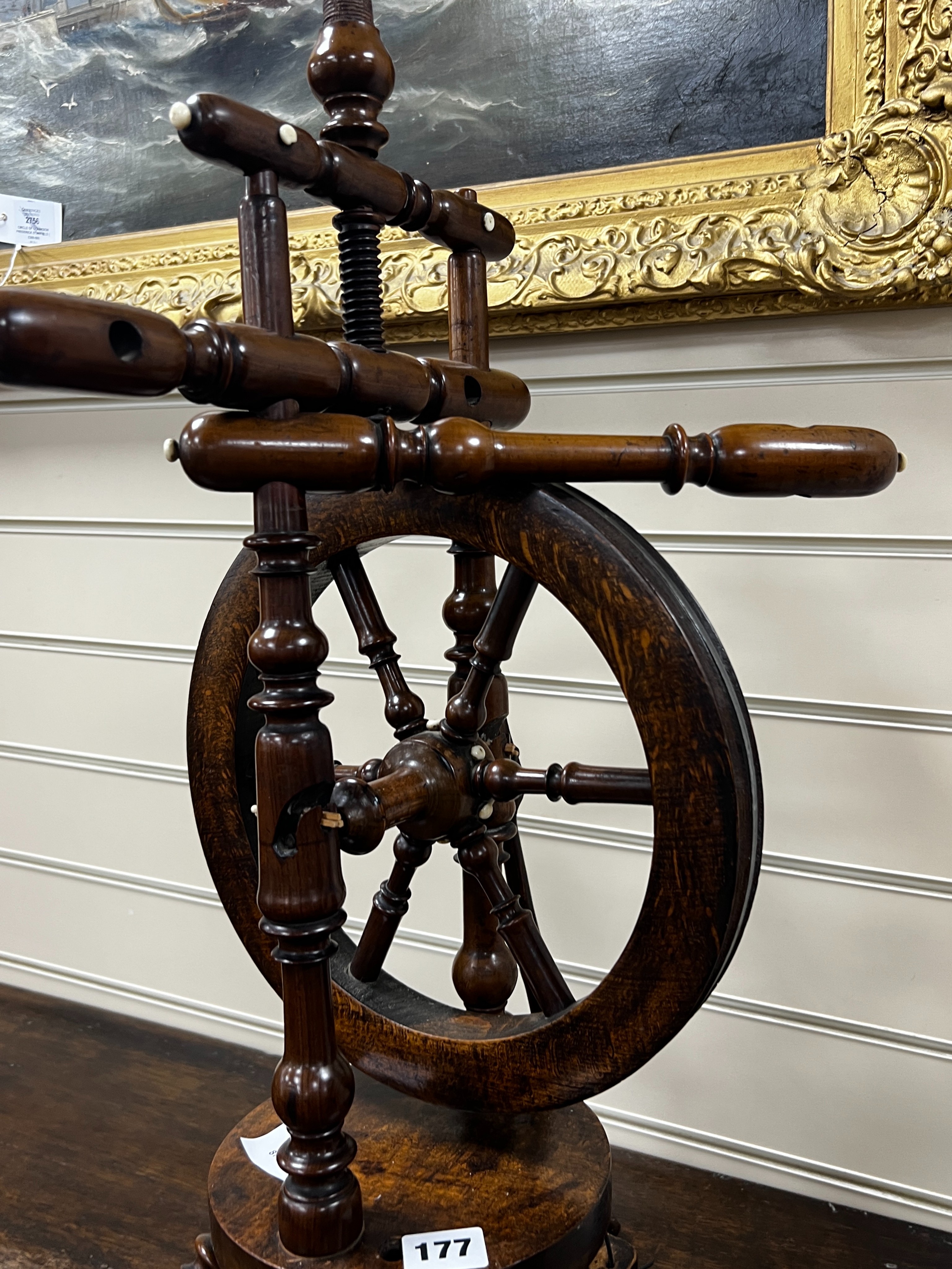 A provincial mahogany and beech spinning wheel, height 67cm